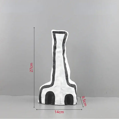Abstract white and black geometric eye pattern vase with textured matte finish for living room decor