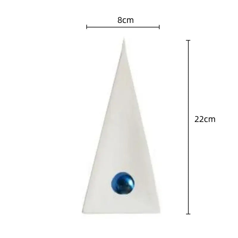 A sleek white geometric triangle decorbites ornament with a glossy blue spherical accent for living room decor