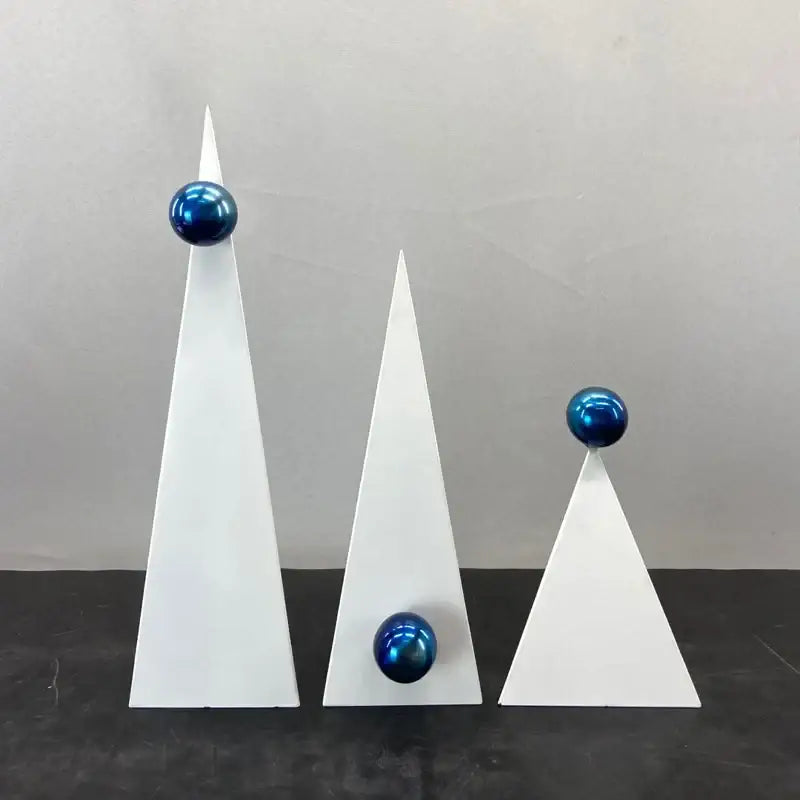 Three white geometric triangle sculptures with glossy blue spheres for decorbites geometric triangle blue living room decor