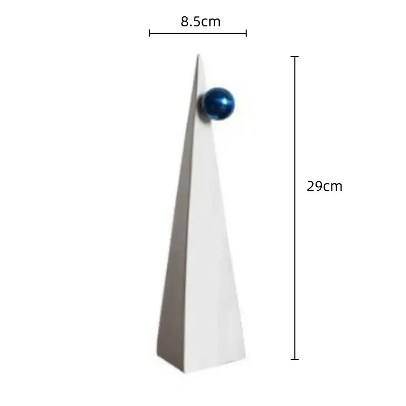 A sleek white ceramic geometric triangle ornament with a glossy blue sphere for living room decorbites decor