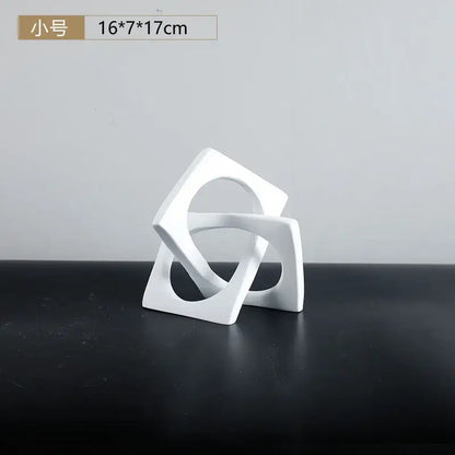 Abstract white ceramic geometric cross square ring bookends featuring interlocking square shapes for living room decorbites geometric cross