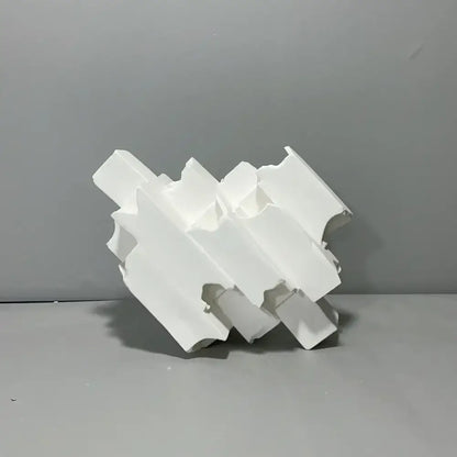 Abstract white decorbites geometric ceramics flower vase with layered angular segments and matte finish for living room