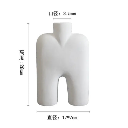 Abstract white geometric ceramic vase shaped like a minimalist human torso for modern living room decorbites ceramic vase