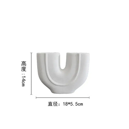 Abstract white geometric ceramic vase with a minimalist u-shaped design and glossy finish for living room decorbites decor
