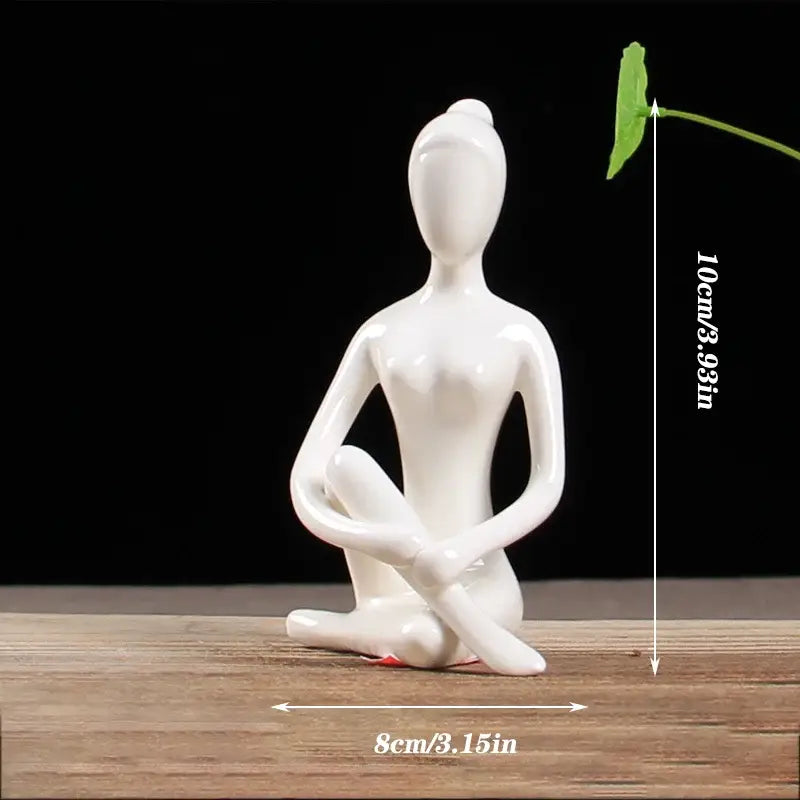 White ceramic abstract yoga figure of seated woman in meditative pose porcelain decorbites living room sculpture