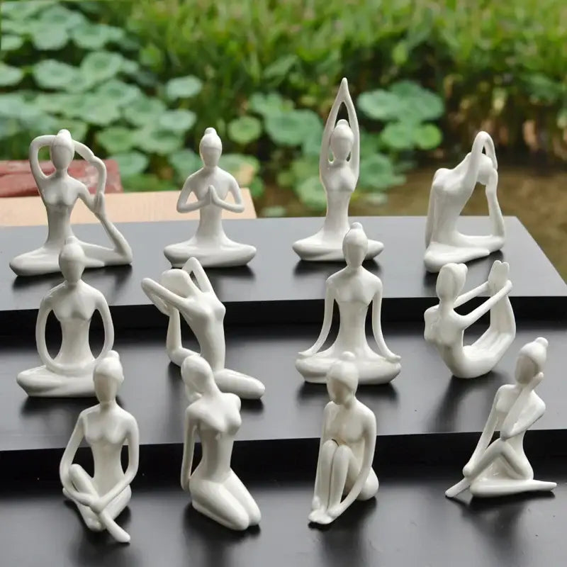 White ceramic yoga figure sculpture featuring abstract yoga poses for living room decorbites abstract yoga decor