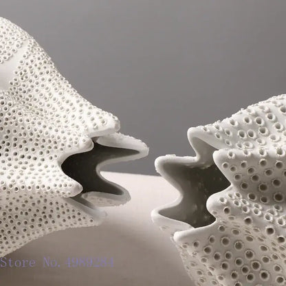 Abstract white textured ceramic vase with porous coral sculpture design featuring dot pattern decor for living room