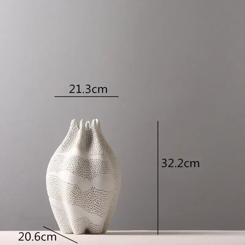 Abstract white textured ceramic vase with dot pattern and three upward-pointing spires for living room decorbites decor