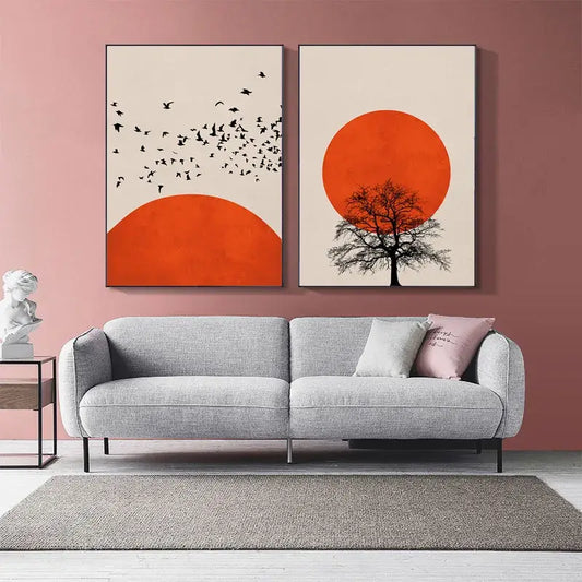 Gray textured fabric sofa with sleek black metal legs and two throw pillows beneath nordic style winter morning landscape canvas print