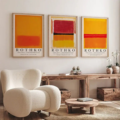 Three framed abstract yayoi kusama wall art prints with bold orange red and yellow blocks in minimalist wooden frames