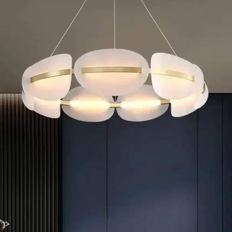 Modern acrylic ring chandelier with frosted glass petals and gold-toned accents for dining room lighting