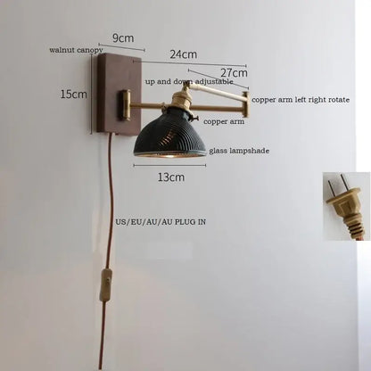 Adjustable brass wall sconce with copper arm, walnut canopy, and black ribbed glass shade for bedroom lighting decorbites copper arm
