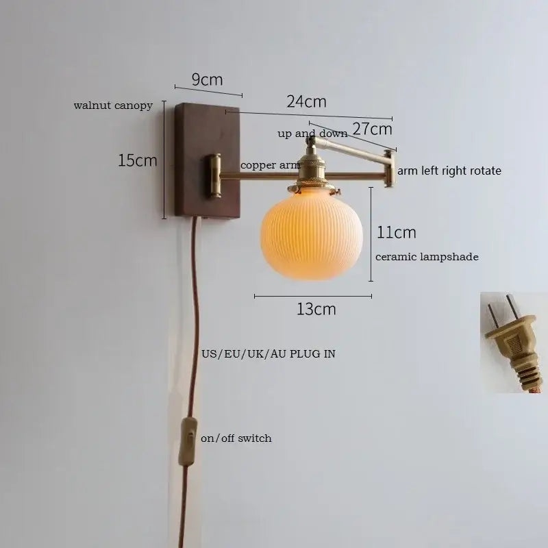 Adjustable brass wall sconce with warm-toned ribbed ceramic lampshade and copper arm mounted on walnut canopy by decorbites copper arm