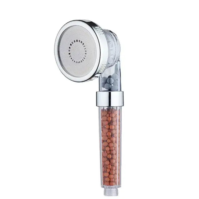 Adjustable high pressure chrome shower head with transparent body containing orange and gray filtration beads for bathroom
