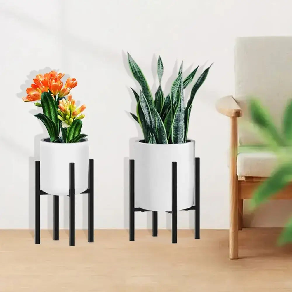 White ceramic planters in black adjustable metal plant stand holding various green houseplants for pots ranging 12-16 inch