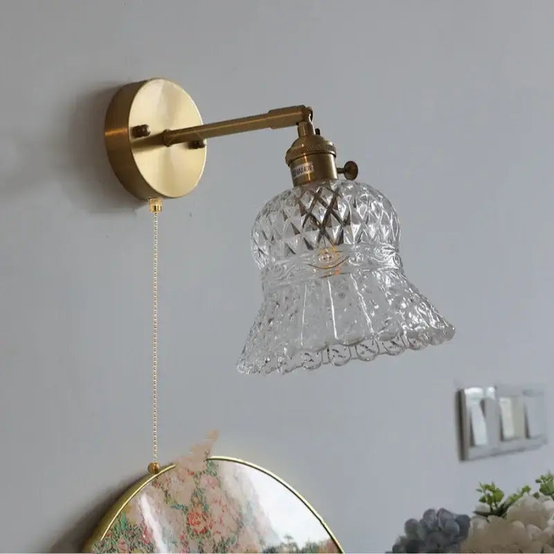 Antique brass wall light fixture with amber flower crystal glass shade and pull chain for bedroom lighting