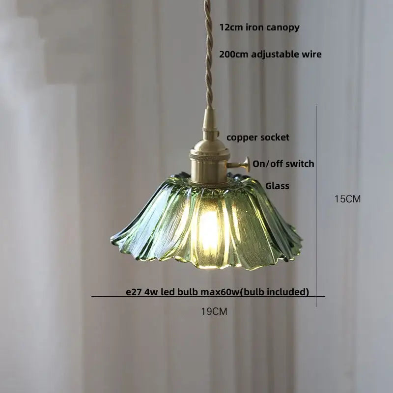 Amber flower glass pendant light featuring delicate green glass petals and brass finish ideal for dining room pendant lights