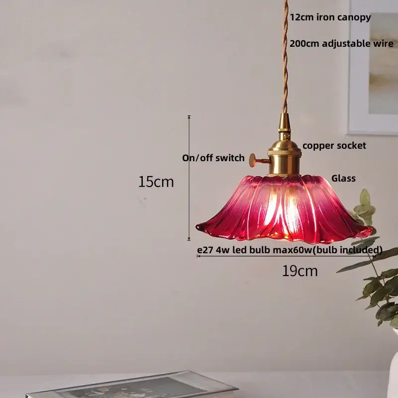 A vibrant red amber flower glass pendant light with fluted petals and brass finish for dining room pendant lights