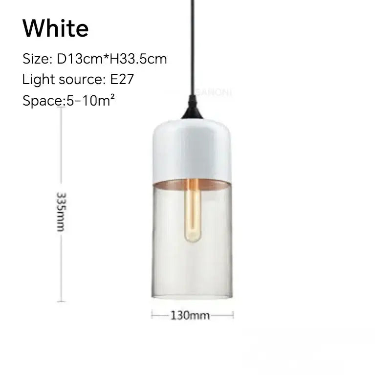 White cylindrical pendant light fixture with clear glass body and frosted top featuring exposed Edison bulb for dining room