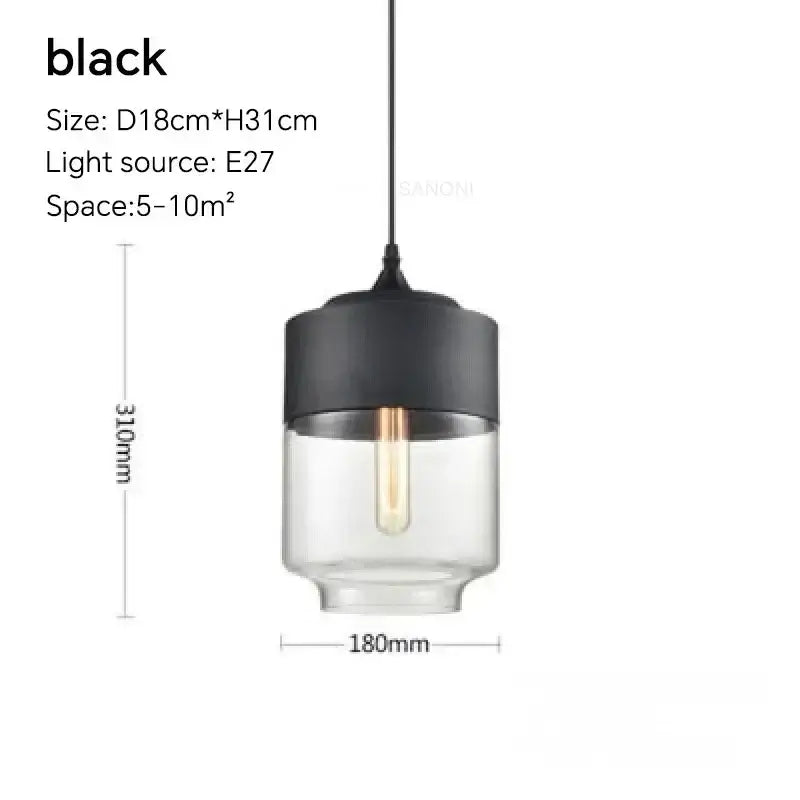 Black cylindrical pendant light fixture with clear glass body and exposed filament bulb for dining room lighting