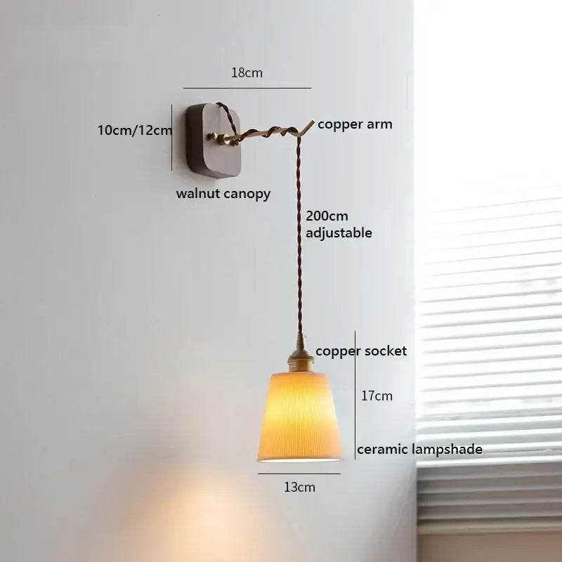 Warm-toned amber ceramic ball led wall lights with ribbed texture on walnut mount and twisted copper arm by decorbites