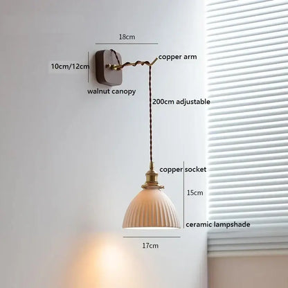 A warm-toned amber ceramic ball led wall light with vertical ridges and pull chain for bedroom decorbites ceramic ball