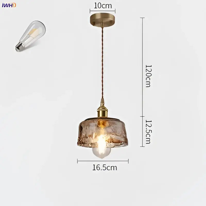 Antique brass-finished copper pendant lights with textured amber glass shade and exposed edison bulb for dining room