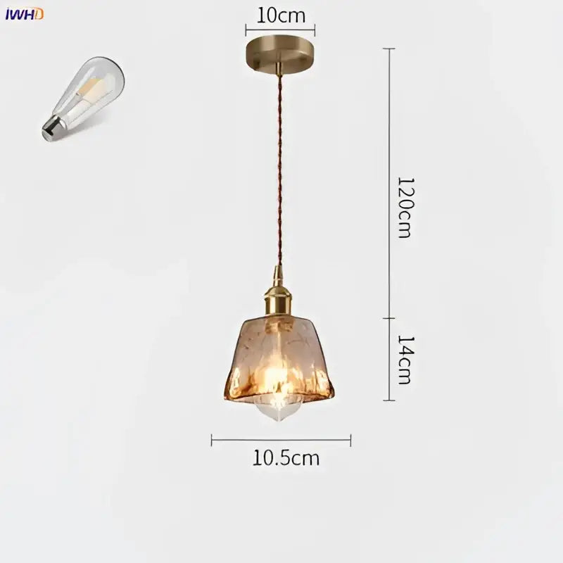 A vintage-style amber glass copper pendant light with textured shade and exposed edison bulb for dining room