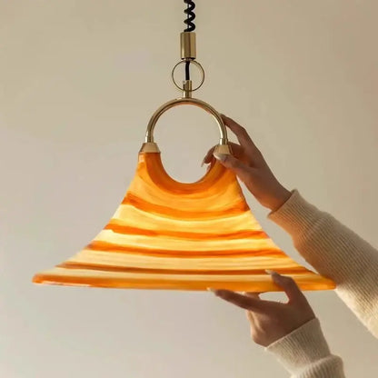 Amber glass liftable trumpet chandelier with warm flared layered design and brass hardware for dining room decorbites liftable