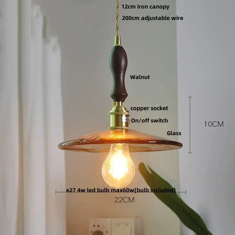Amber glass pendant light with brass knob switch and walnut iron canopy ideal for dining room decorbites brass knob