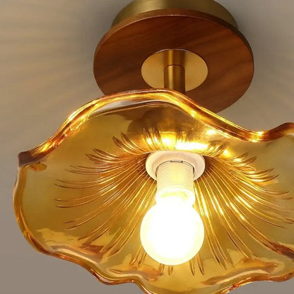 Golden glass shell ceiling light with wood copper led base and brass accents for dining room illumination
