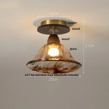 A warm amber glass ceiling light with copper and wood fixture featuring decorbites amber ice crack design