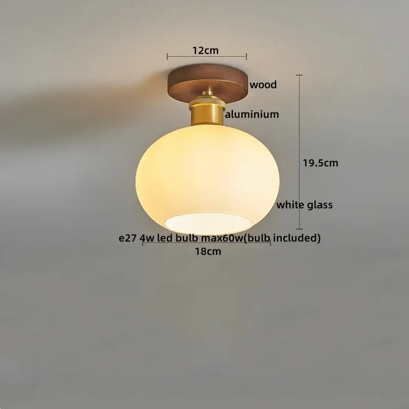 Amber leaf brass glass ceiling lamp with warm white spherical glass, wooden mount, and decorbites brass glass hardware