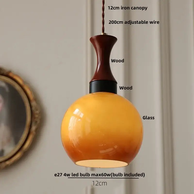 Amber wood glass pendant light with warm amber led pendant shade, dark wood neck, and twisted copper cord decorbites amber led