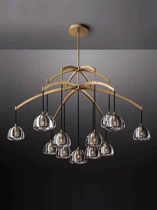 A modern american copper crystal chandelier with brass and clear glass globes and black cords for living room decor