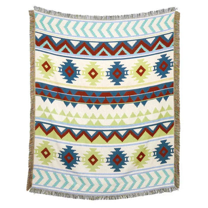 A woven american country plaid blanket sofa cover with blue red and green geometric tribal pattern and fringed edges