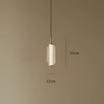 A sleek american retro frosted glass staircase pendant light with cylindrical glass shade and metallic accents for dining room