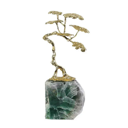 Golden metallic brass tree ornament bonsai sculpture on a translucent green and white fluorite stone base for living room