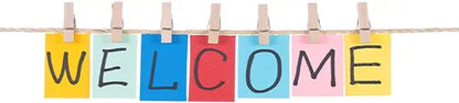 Colorful sticky notes spelling welcome clipped to a string in decorbites animal print rainbow movie posters wall decor