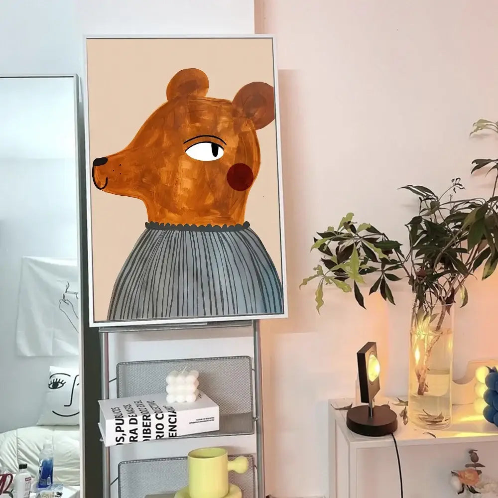 A framed DecorBites™ animal print rainbow poster featuring a stylized brown bear in a gray pleated skirt