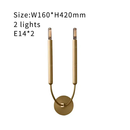 Antique art deco gold-toned wall lamps with two candle-style arms and circular base for living room mirror lights
