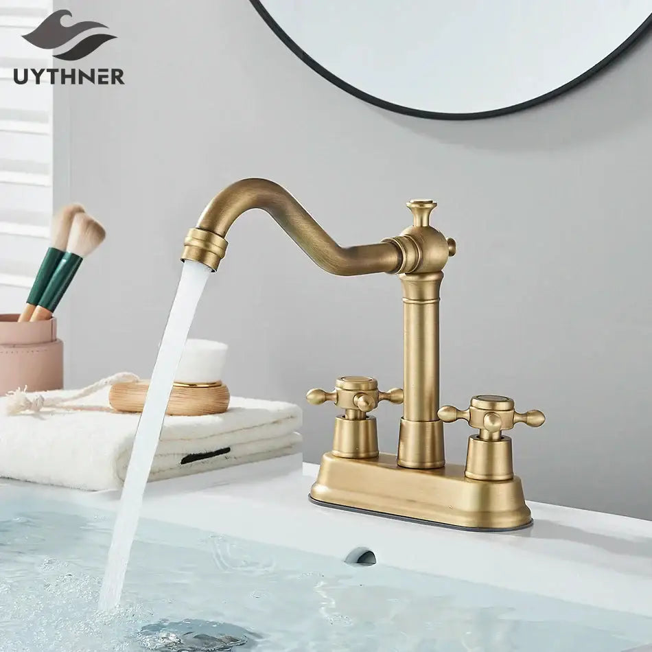Antique black brass waterfall basin faucet with antique brass finish curved spout and two cross-handle knobs decorbites black brass