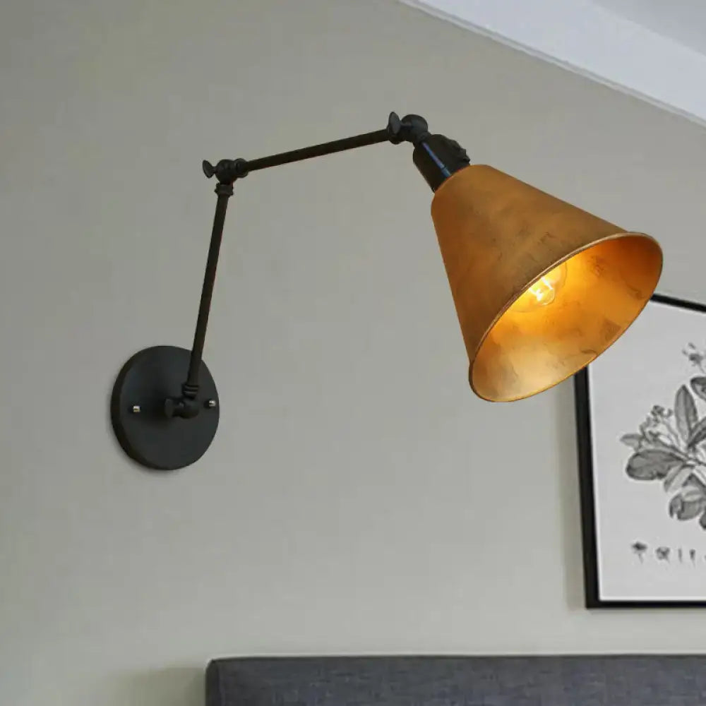 DecorBites™ direct wired wrought iron wall sconce with matte black arm and warm brass conical shade