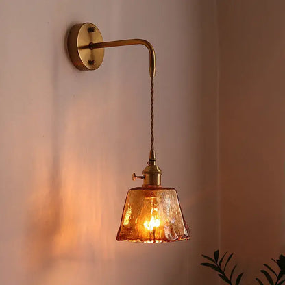 Antique brass wall lights with textured amber glass copper led shade and twisted cord for bedroom lighting