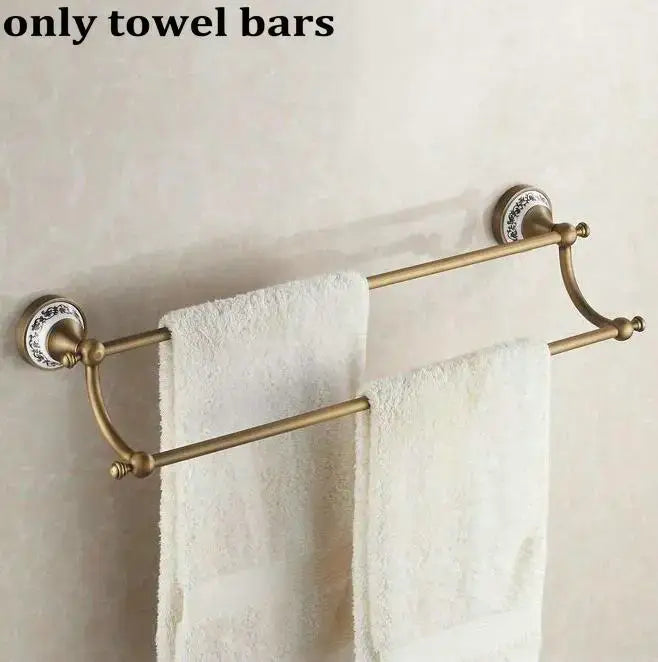 Antique brass double towel bar with ornate ceramic wall mounts in decorbites bathroom accessories set for bathroom decor