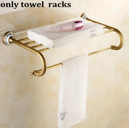 Gold-toned metal towel rack with decorative blue and white ceramic end caps in decorbites bathroom accessories set