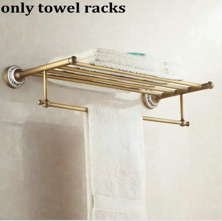 Antique brass and ceramic double-tier towel rack with ornate circular mounts holding white towels for decorbites bathroom accessories set