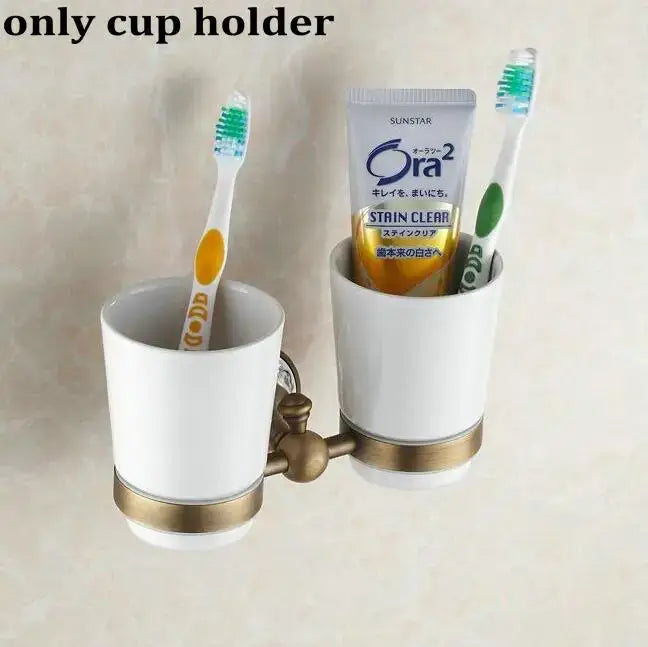 White ceramic cup holder with gold-toned metal accents and dual-cup design from decorbites bathroom accessories set