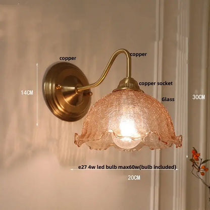 Antique brass wall sconce with textured amber clear glass shade and ruffled edges for decorbites clear glass bedroom light