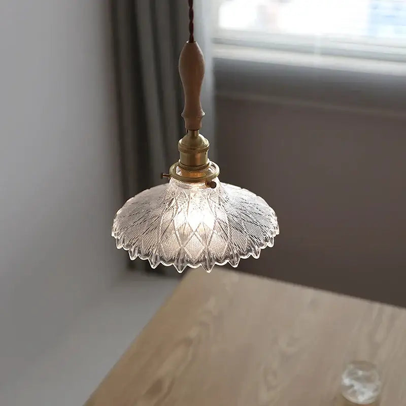 Antique brass and glass led pendant lamp with clear glass, brass fixture, and wooden handle for kitchen lighting